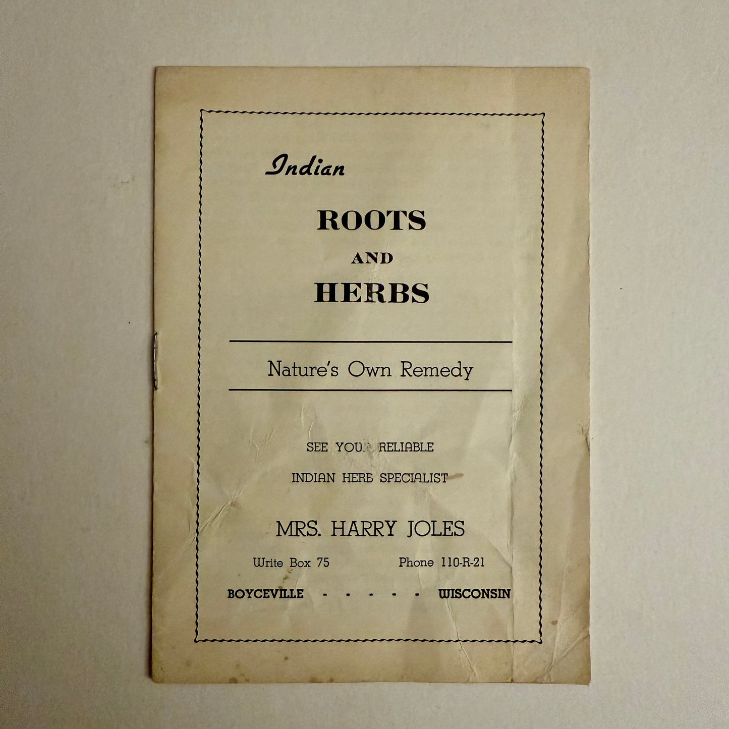 Vintage paper with text about Indian roots and herbs on a beige background