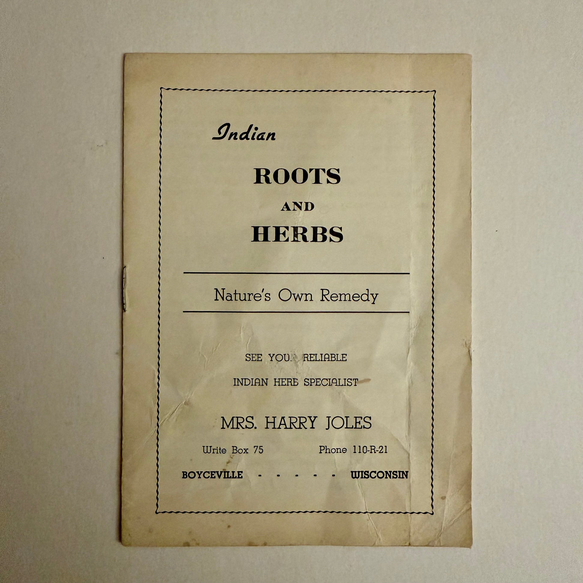 Vintage paper with text about Indian roots and herbs on a beige background