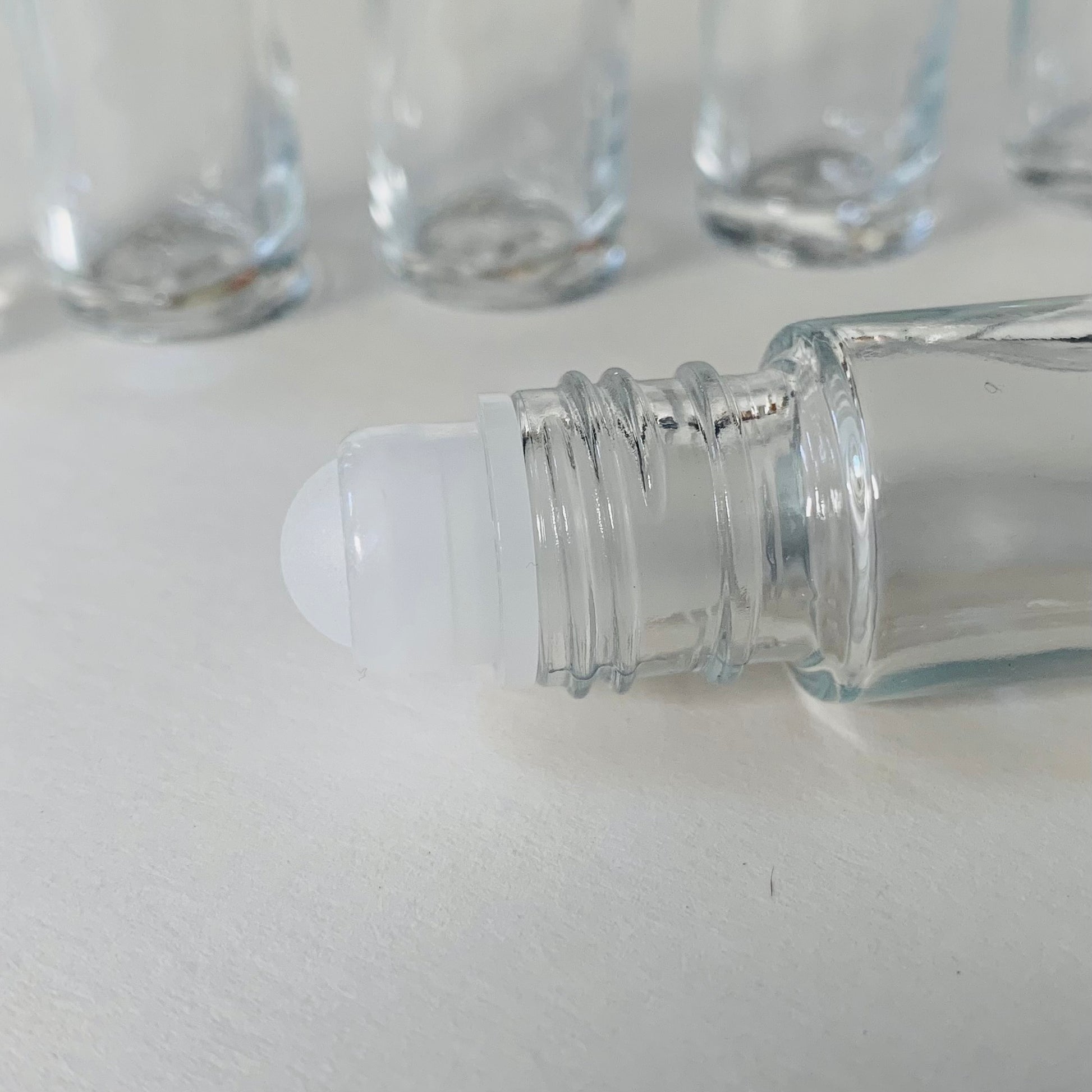 0.33 oz Clear Glass Oblong Roll-On Bottles (White PP Cap) - Clear Type I